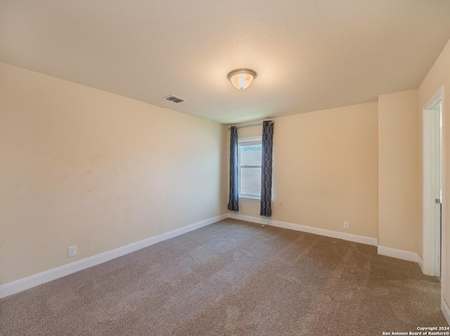 unfurnished room featuring carpet floors