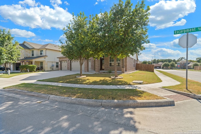 view of front of home with a garage and a front yard