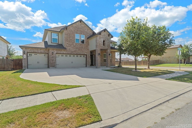 view of front of property featuring a garage and a front yard