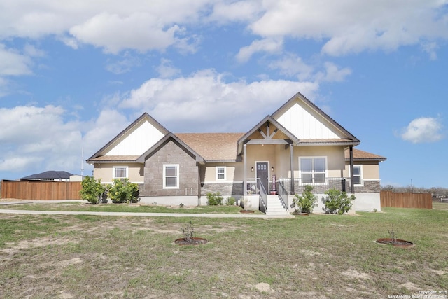 craftsman inspired home with a front lawn and a porch