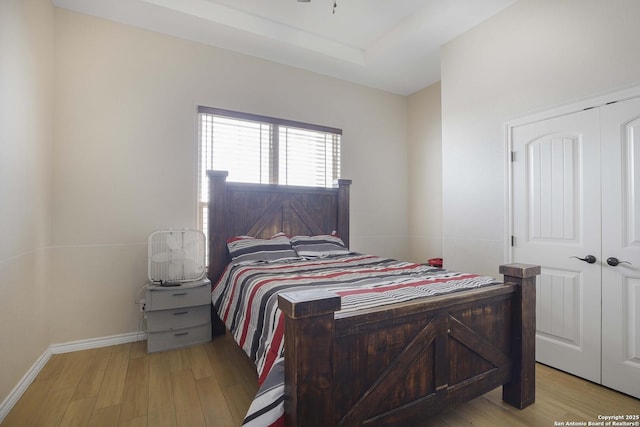 bedroom featuring light hardwood / wood-style flooring and a closet