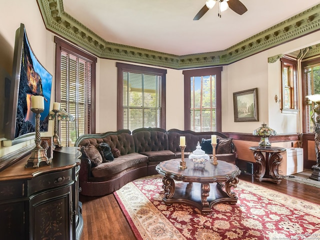 living room with ceiling fan, hardwood / wood-style floors, and crown molding