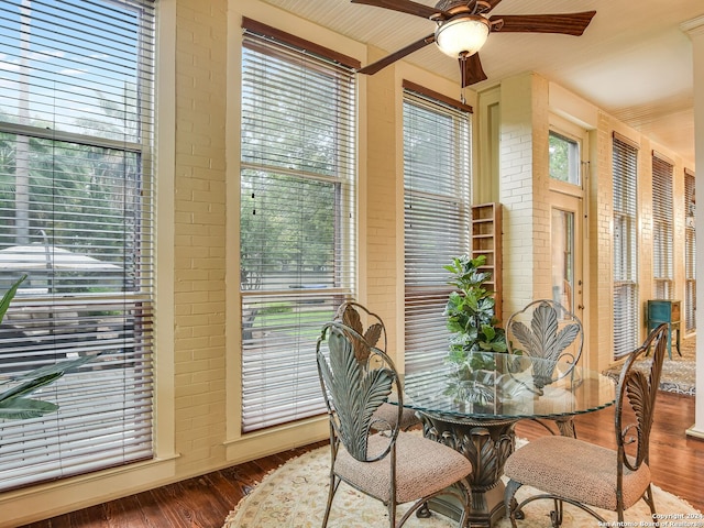 dining area with wood-type flooring, a wealth of natural light, and ceiling fan