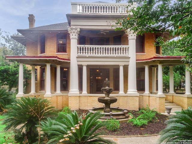 back of house with a balcony