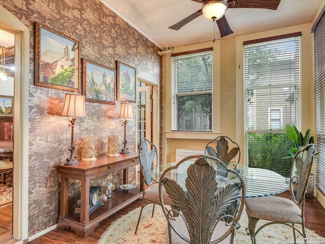 sunroom featuring ceiling fan and vaulted ceiling