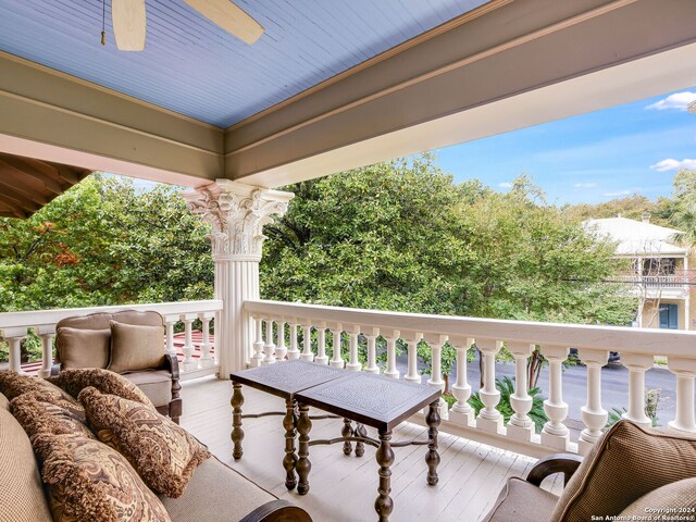 balcony featuring an outdoor hangout area and ceiling fan