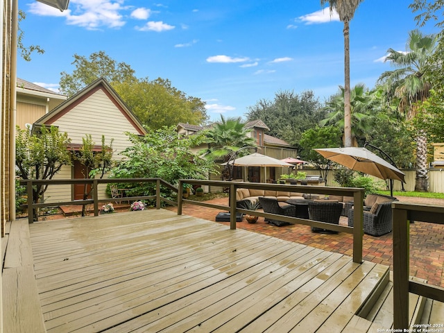 wooden terrace featuring outdoor lounge area