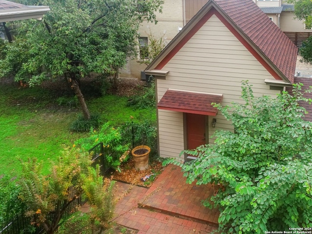 view of side of home with a patio area