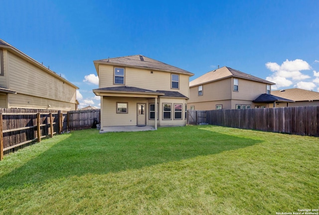 rear view of property with a patio area and a lawn