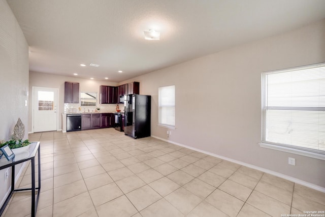 kitchen with backsplash, a wealth of natural light, black refrigerator with ice dispenser, and dishwashing machine