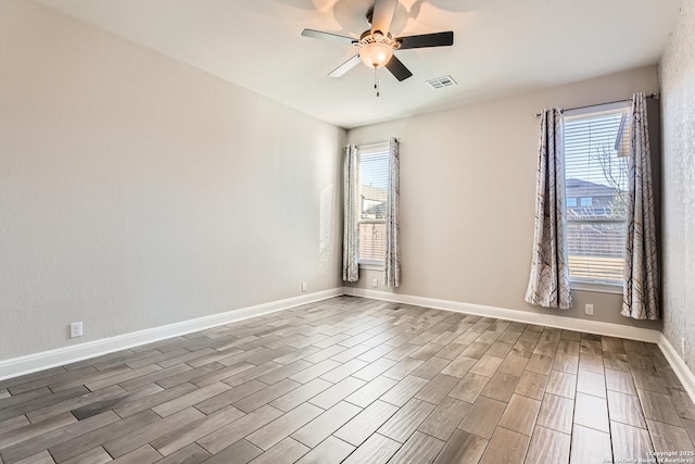 unfurnished room with ceiling fan