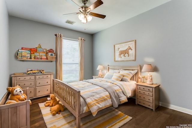 bedroom featuring ceiling fan and dark hardwood / wood-style floors