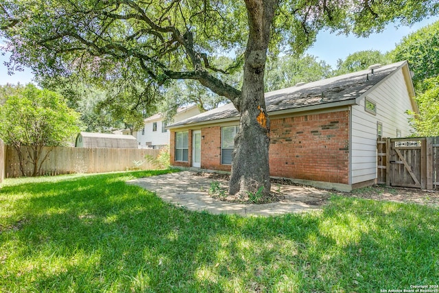 rear view of house with a lawn