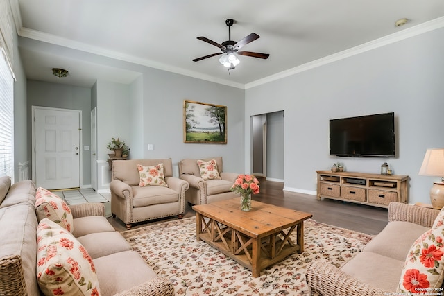 living room featuring ceiling fan, light hardwood / wood-style floors, and ornamental molding