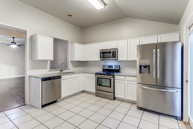 kitchen featuring white cabinets, sink, ceiling fan, light tile patterned floors, and stainless steel appliances