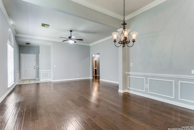 spare room featuring crown molding, dark hardwood / wood-style flooring, and ceiling fan with notable chandelier