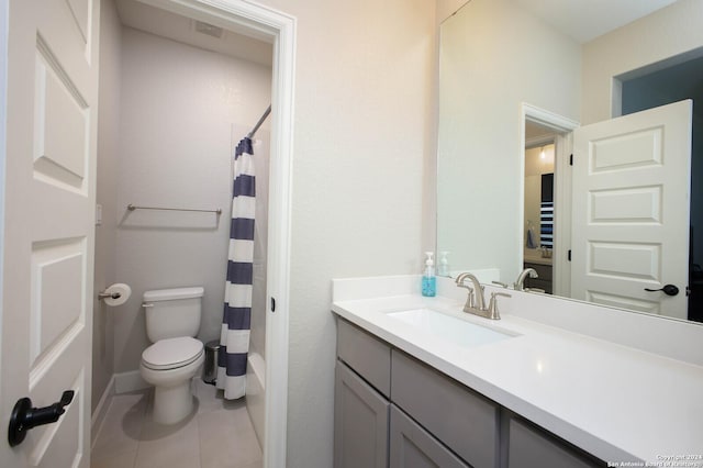 full bathroom with shower / bath combo with shower curtain, tile patterned flooring, vanity, and toilet