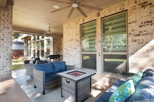 view of patio with ceiling fan, an outdoor living space with a fire pit, and a grill