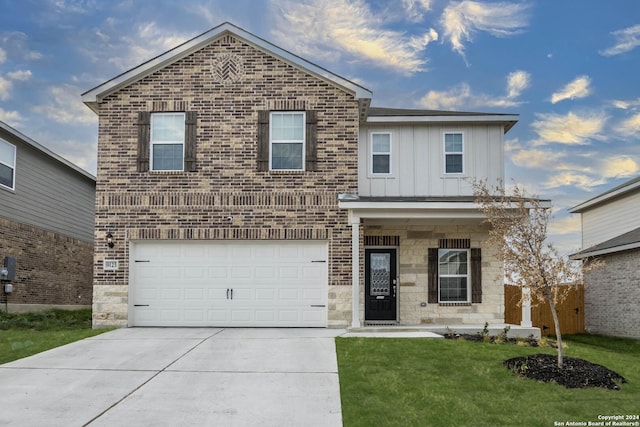 view of front of property with a garage and a front yard