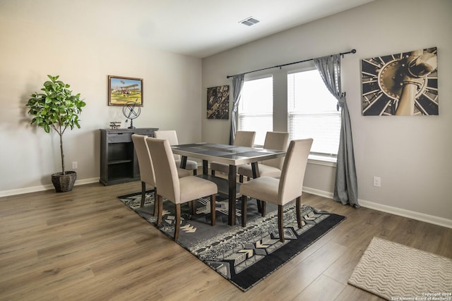 dining area featuring wood-type flooring