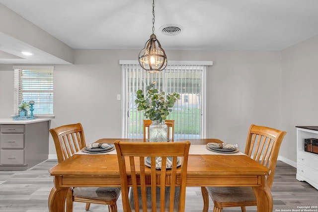 dining space featuring light hardwood / wood-style floors