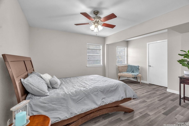 bedroom featuring ceiling fan and light hardwood / wood-style floors