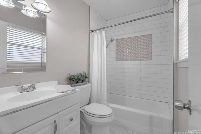 full bathroom with shower / bath combination with curtain, vanity, and toilet