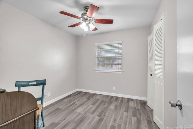 home office featuring ceiling fan and light hardwood / wood-style floors