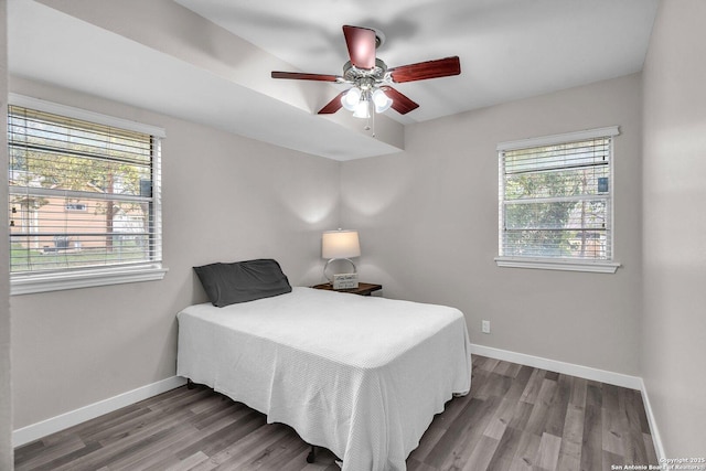 bedroom with ceiling fan and hardwood / wood-style floors