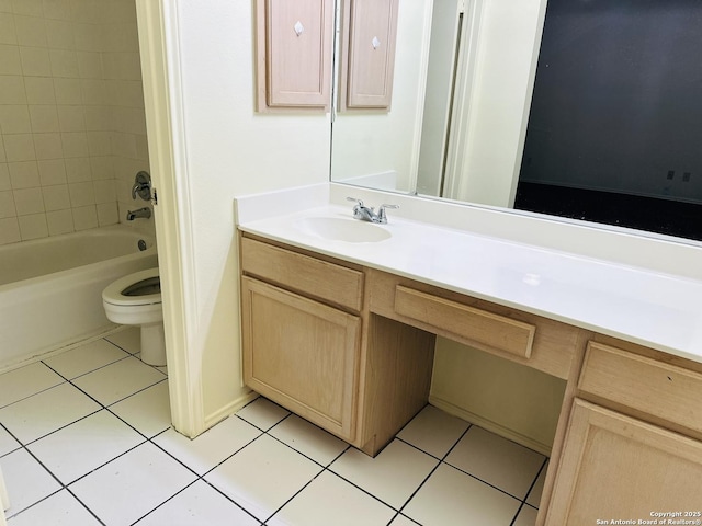 full bathroom featuring tile patterned flooring, vanity, toilet, and tiled shower / bath