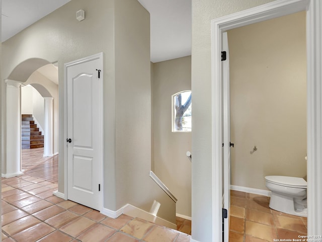 hall featuring light tile patterned floors