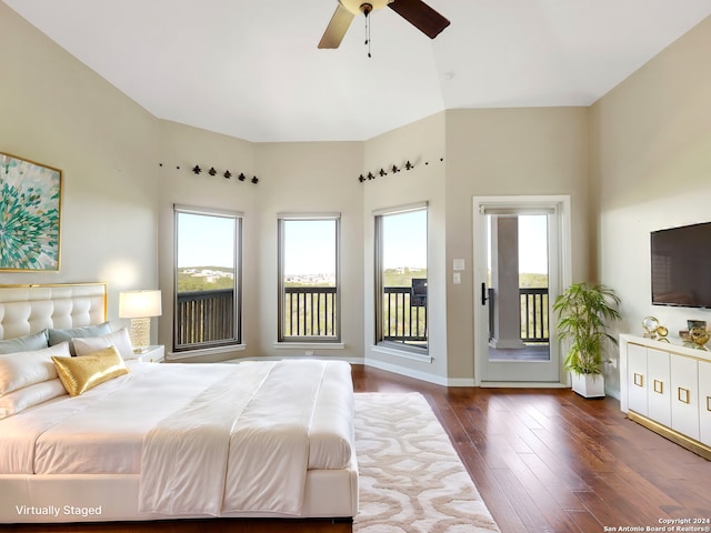 unfurnished bedroom featuring access to outside, multiple windows, ceiling fan, and dark hardwood / wood-style flooring