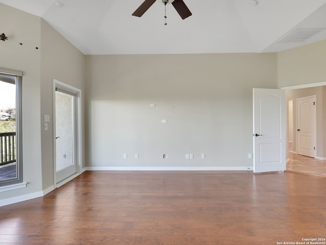 spare room with hardwood / wood-style floors, plenty of natural light, and ceiling fan