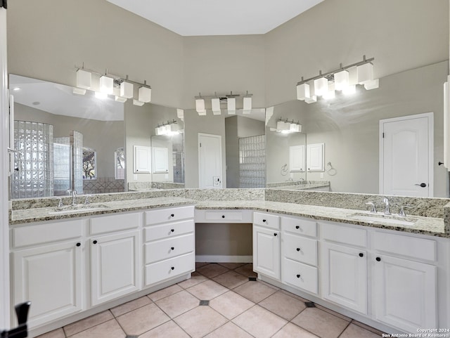 bathroom with tile patterned flooring and vanity