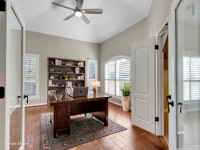 office with ceiling fan, wood-type flooring, and vaulted ceiling