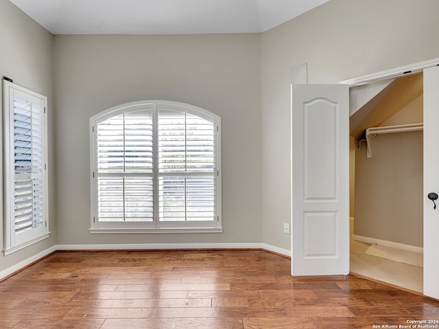 unfurnished bedroom with hardwood / wood-style floors