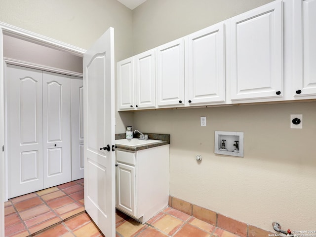 clothes washing area with electric dryer hookup, cabinets, hookup for a gas dryer, sink, and washer hookup