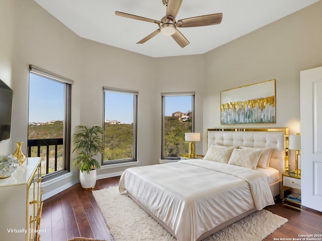 bedroom with ceiling fan and dark wood-type flooring