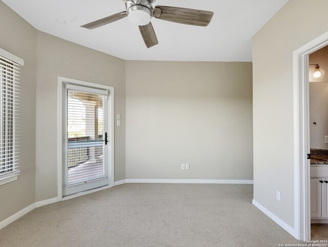 empty room with carpet floors and ceiling fan