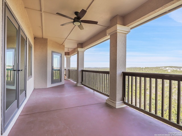 view of patio / terrace featuring ceiling fan and a balcony