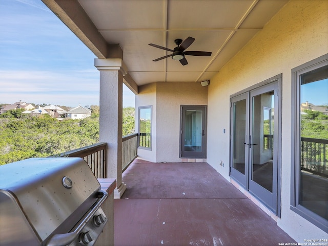 view of patio featuring french doors, area for grilling, and ceiling fan