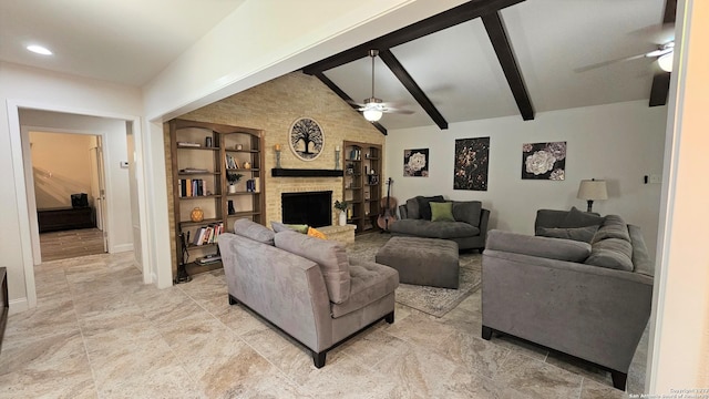 living room featuring a large fireplace, lofted ceiling with beams, ceiling fan, and built in features