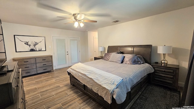 bedroom featuring french doors and ceiling fan