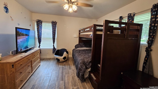 bedroom featuring dark hardwood / wood-style flooring and ceiling fan