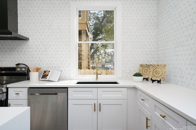 kitchen with white cabinetry, range with electric cooktop, sink, wall chimney range hood, and stainless steel dishwasher