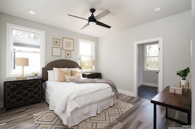 bedroom featuring ceiling fan and dark wood-type flooring