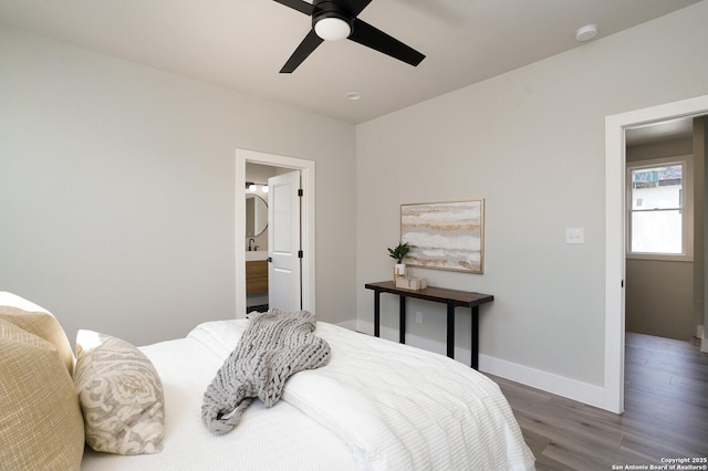 bedroom with ceiling fan and dark hardwood / wood-style floors