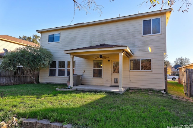 back of house with a lawn, ceiling fan, central air condition unit, and a patio