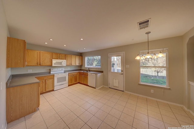 kitchen featuring sink, an inviting chandelier, decorative light fixtures, white appliances, and light tile patterned floors