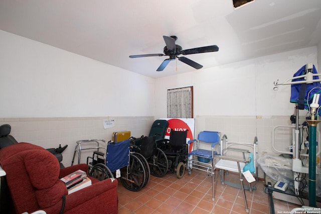 interior space with ceiling fan and light tile patterned floors